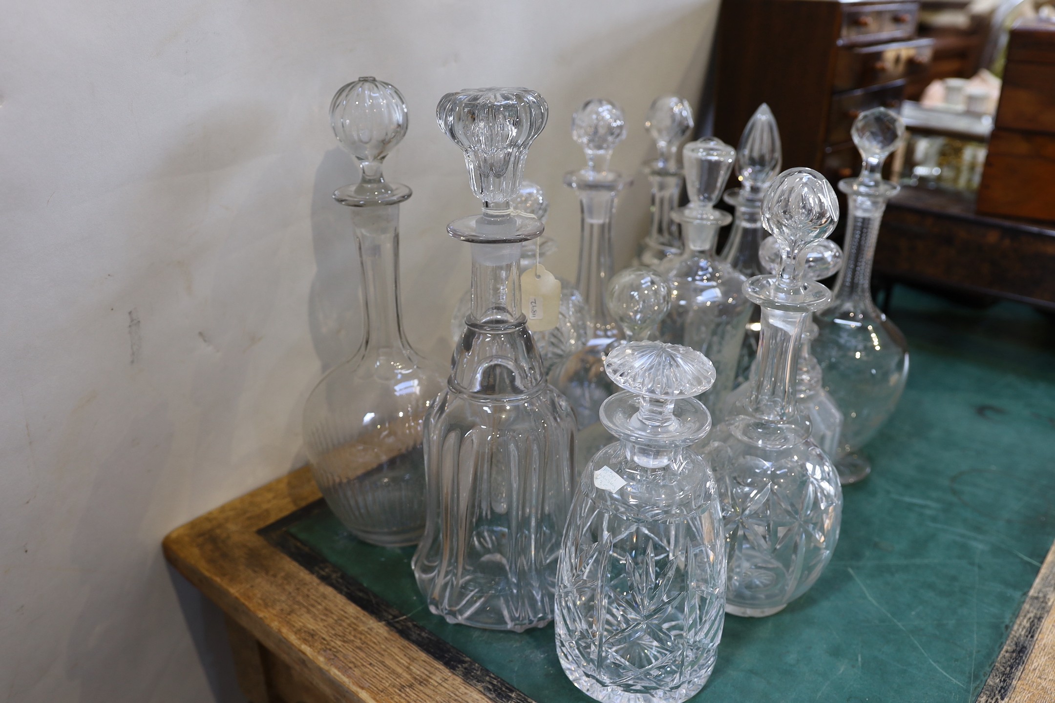 Twelve Victorian and later glass decanters and stoppers, tallest 35cm